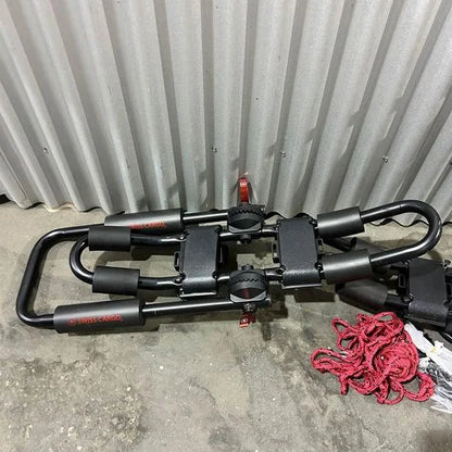 Swiss Cargo 3-in-1 Kayak Carrier folded flat for storage with red tie-down rope next to it.