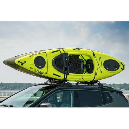 Green kayak secured on vehicle roof using Swiss Cargo 3-in-1 Kayak Carrier.