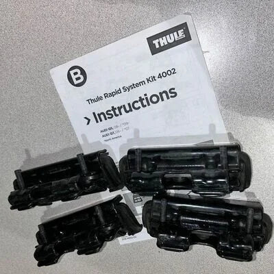 Thule Rapid System Kit 4002 with instructions on a gray background