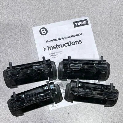 Thule Rapid System Kit 4002 with instructions on a gray background
