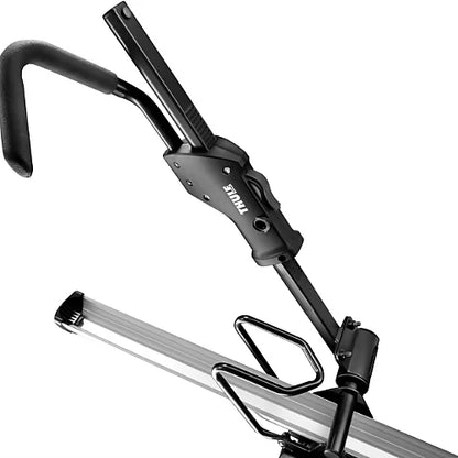 Close-up of Thule 594XT Sidearm rooftop bike carrier showing SecureHook holding front wheel without frame contact.