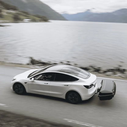 Thule Arcos Box & Platform Bundle Box on white car driving along ocean road