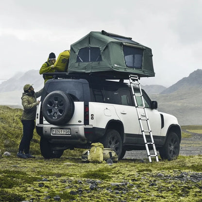 Caprock Platform on a white SUV with rooftop tent setup, ideal for overlanding.

