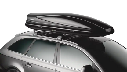Close-up view of the cargo box mounted on the roof rails of a silver SUV.