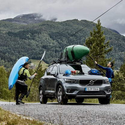 Thule Hull-a-Port XTR Kayak Rack
 on car with kayak. People standing next to it