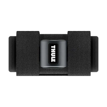 Close-up of Thule SkiClick strap with Thule logo on black fabric

