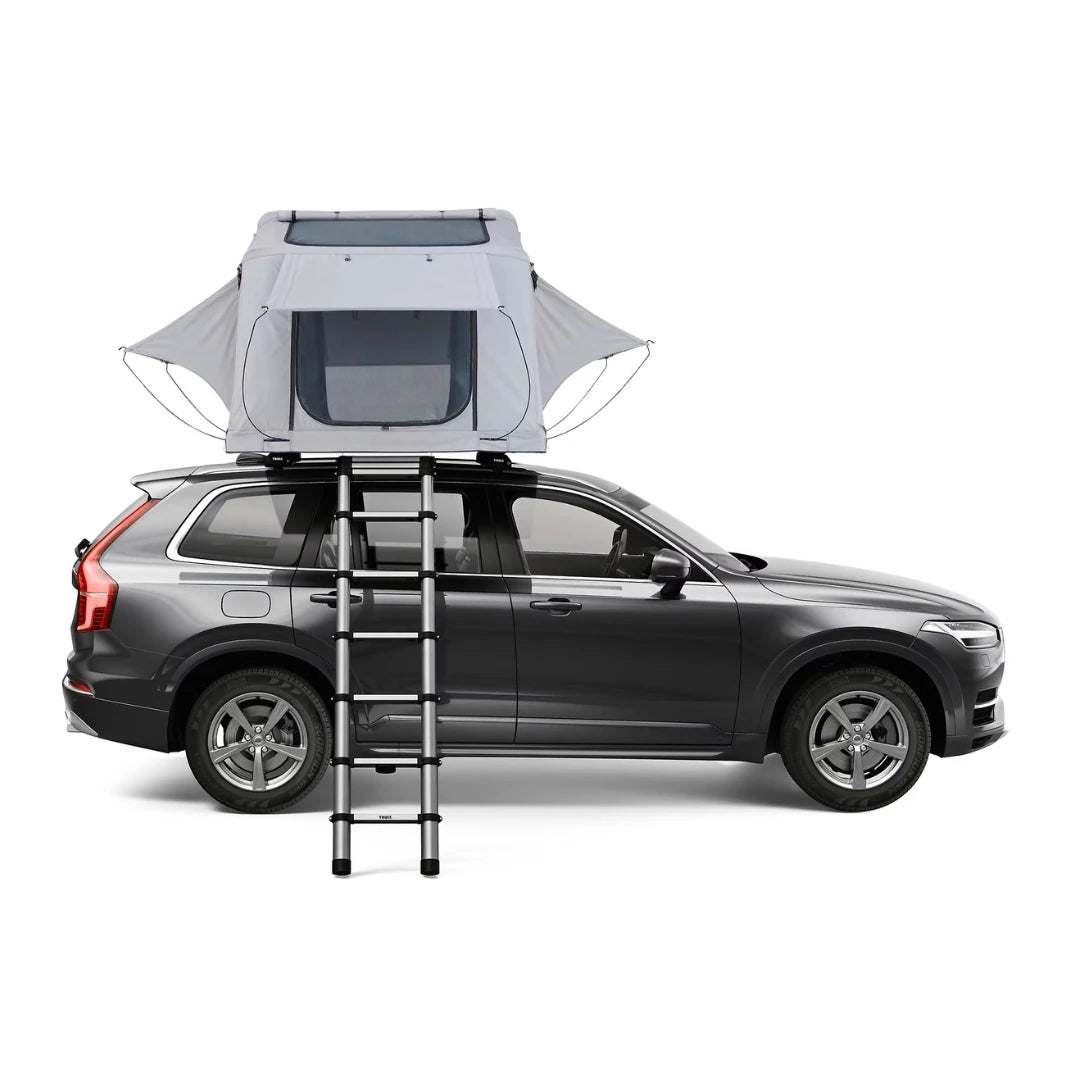 Rear view of tent mounted on car roof with ladder down