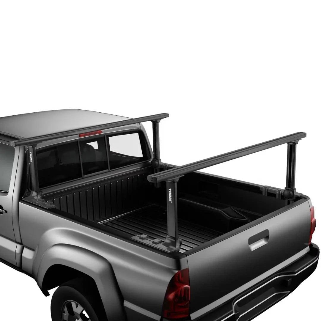 Thule Xsporter Pro mounted on a black pickup truck bed, demonstrating height-adjustable crossbars