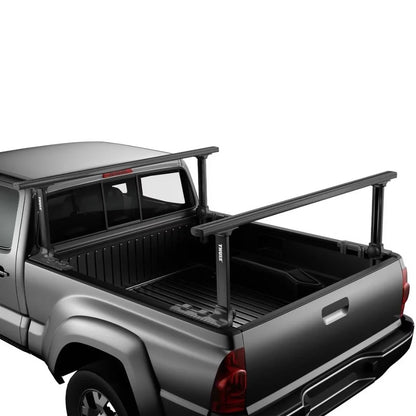 Thule Xsporter Pro mounted on a black pickup truck bed, demonstrating height-adjustable crossbars