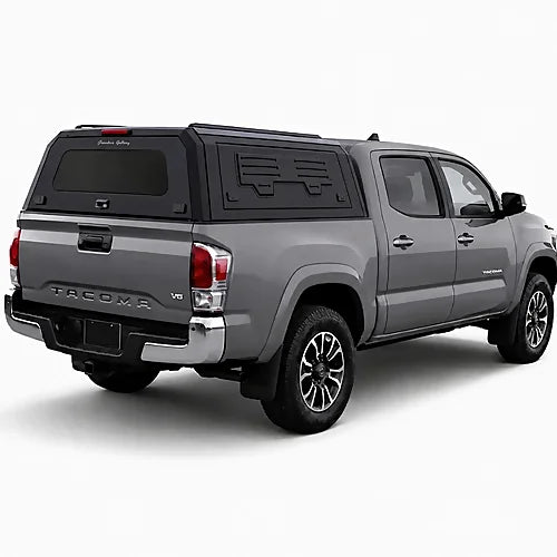 GullWing aluminum truck cap with tinted rear glass and lockable side doors on an overland pickup truck