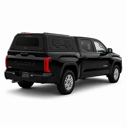 GullWing aluminum truck cap with tinted rear glass and lockable side doors on an overland pickup truck