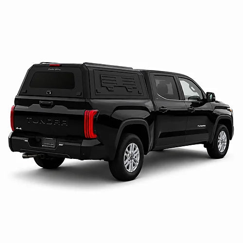 GullWing aluminum truck cap with tinted rear glass and lockable side doors on an overland pickup truck