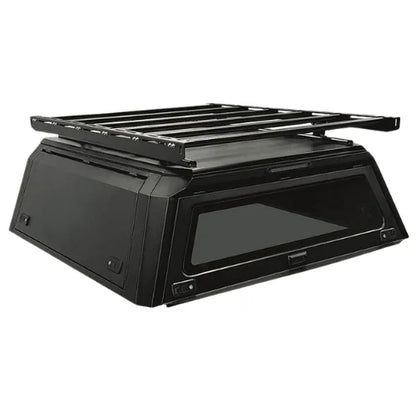 platform rack on a aluminum truck cap. roof platform installed on a gullwing aluminum truck canopy front side