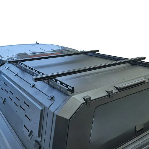 Roof rack system on a vehicle with t tracks on a white background
