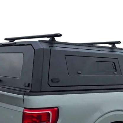 Truck Cap Canopy Rack installed on a gullwind truck cap on a silver truck with white background