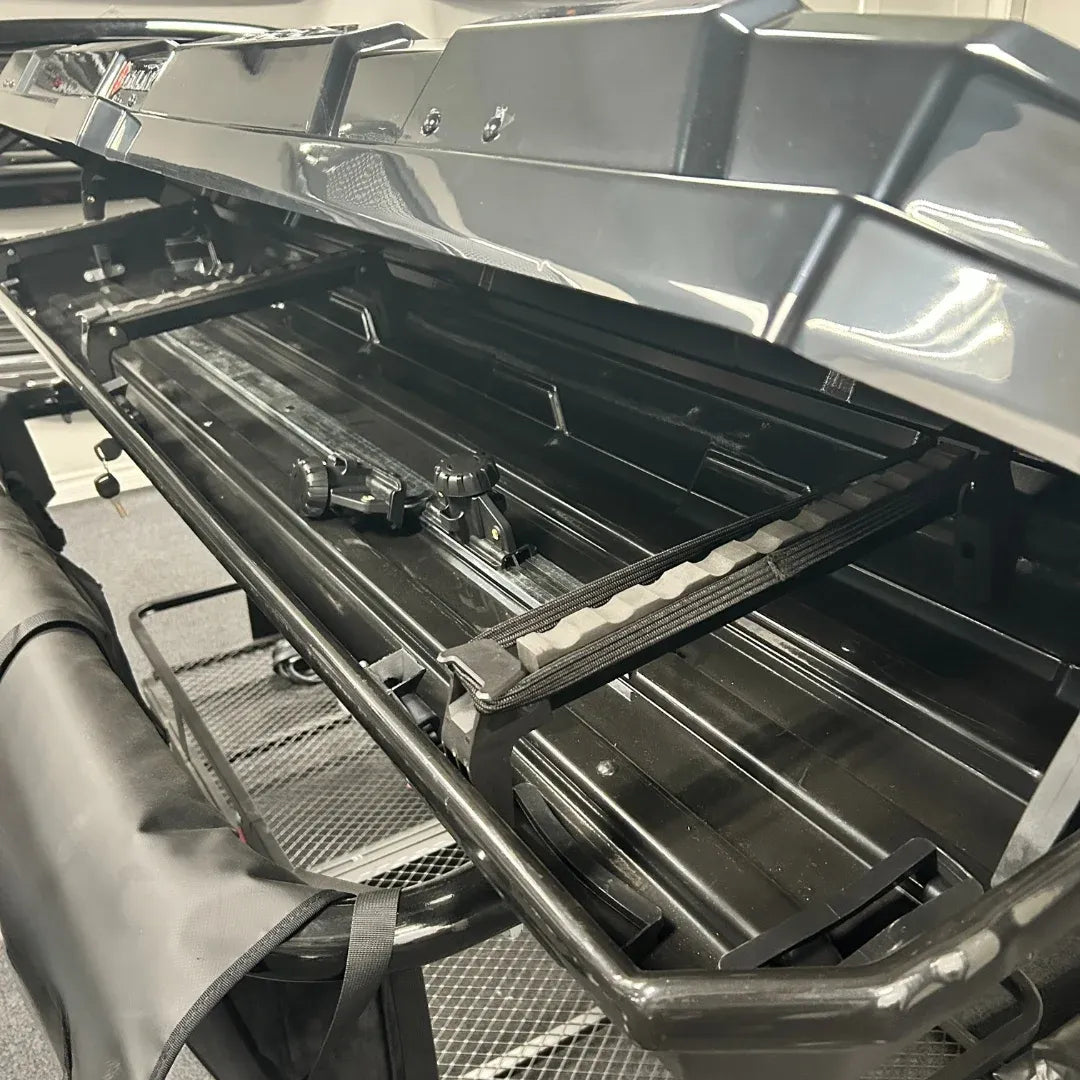 Open AO alpine cargo box showing spacious interior and secure straps