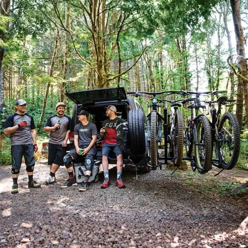 Group of people with bicycles in a forest setting