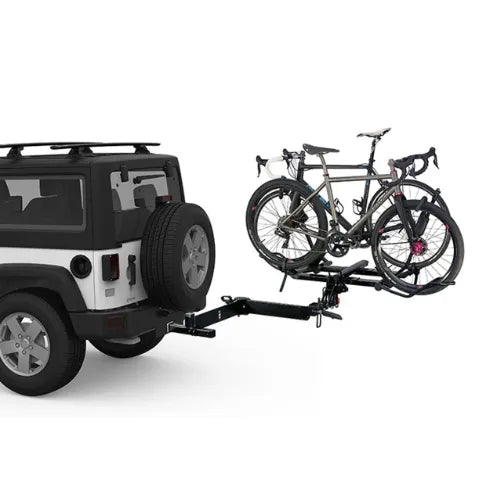Jeep with a bike rack carrying two bicycles on a white background