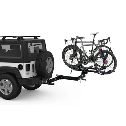 Jeep with a bike rack carrying two bicycles on a white background