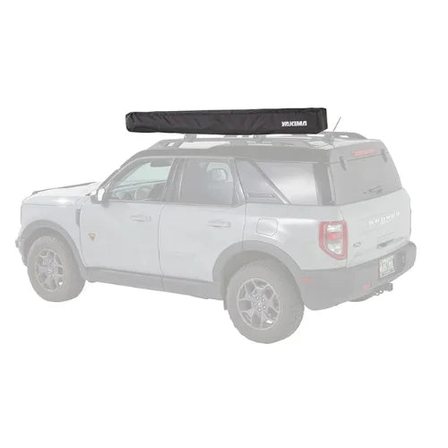 Yakima OverNOut 270 LG and XL rooftop awning in closed position mounted on SUV roof rack, showcasing compact overlanding shade system from Adventure Outdoors Canada.