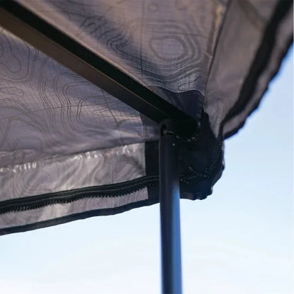 Detail of Yakima OverNOut 270 rooftop awning corner with reinforced fabric, zipper seam, and sturdy support pole, engineered for stability, weather resistance, and reliable shelter during camping and overlanding adventures.