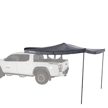 Yakima OverNOut 270 rooftop awning deployed on pickup truck providing extended side shade coverage, durable weather protection, and reliable shelter for camping, overlanding, and outdoor travel adventures