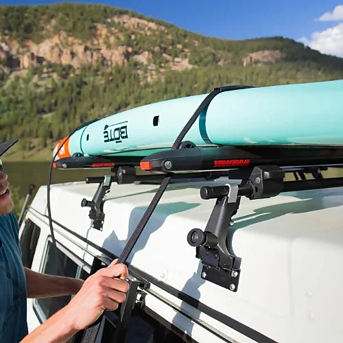 Yakima 1A Raingutter towers with round bar carrying stand-up paddleboard on vehicle roof