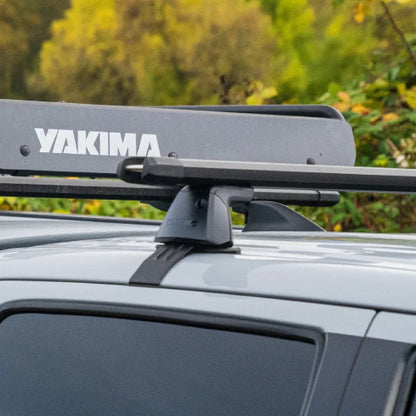 Yakima BaseLine Tower securely mounted on vehicle roof with crossbar system for cars without roof rails