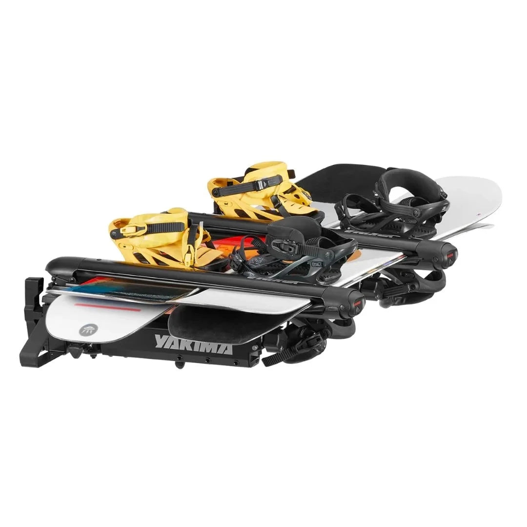 Yakima EXO SnowBank holding 4 snowboards with bindings
