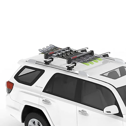 SUV with Yakima FreshTrack ski rack loaded with skis on roof.