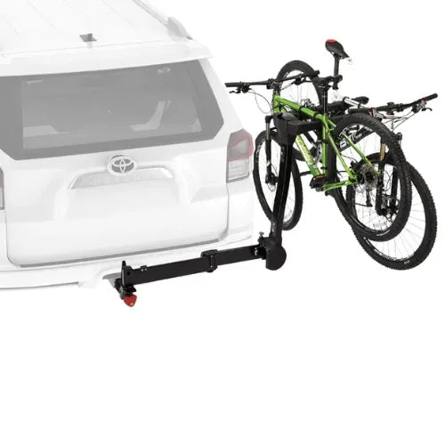 Bicycle rack attached to a white car with two bikes on it.