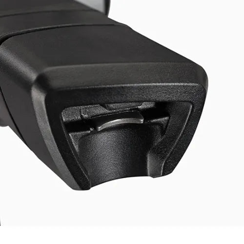 Close-up of a black plastic component on a white background