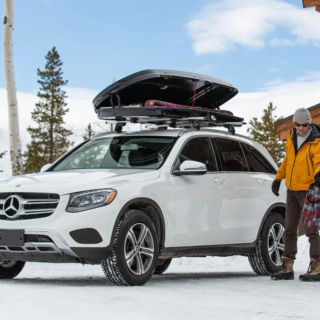 Yakima GrandTour Lo open, on car parked in the snow, loaded with skis