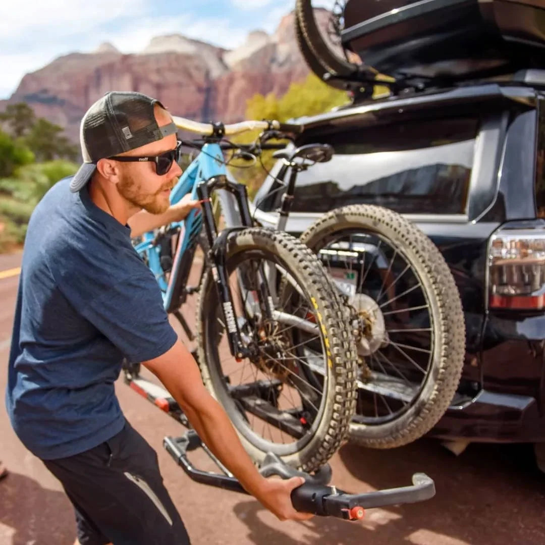 Yakima HoldUp man attaching bikes to it