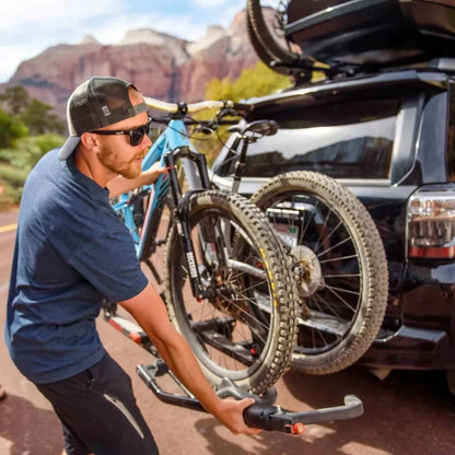Yakima HoldUp man attaching bikes to it