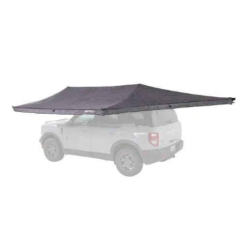 Car with a large gray awning extended over it on a white background