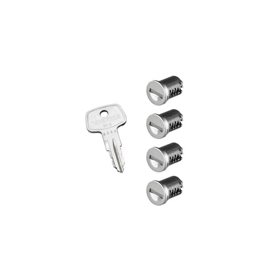 Four Yakima SKS lock cores with a single key on white background

