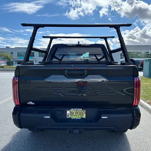 Rear view of adjustable stainless steel truck bed rack mounted on pickup