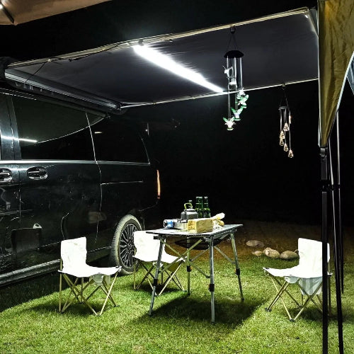 AeroShade AO awning with built-in 3-tone LED strip lighting a nighttime campsite