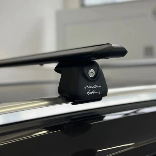 AetherBars AO flush rails roof racks installed on vehicle with low-profile aerodynamic crossbar and secure locking base.