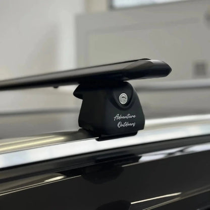 AetherBars AO flush rails roof racks installed on vehicle with low-profile aerodynamic crossbar and secure locking base.