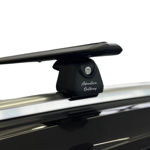AetherBars AO roof racks mounted on raised roof rails showing secure clamp fit and aerodynamic crossbar design