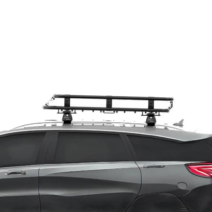 Side profile of Alloy AO Medium roof basket on SUV showing low-profile height, wind fairing, and crossbar mounting brackets
