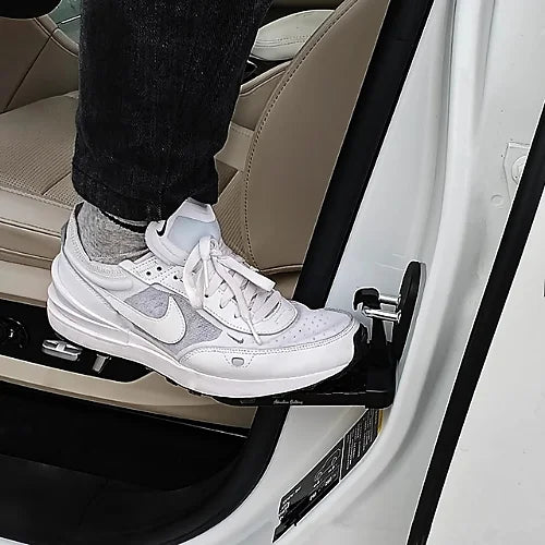 AO 2.0 door step in use attached to car latch with person stepping on it