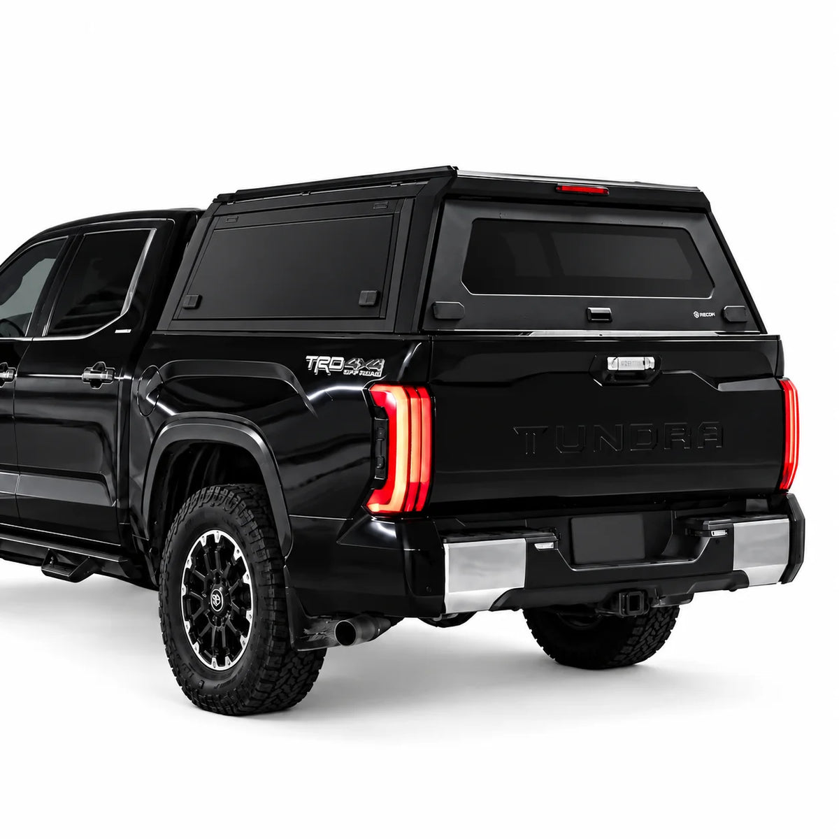 truck canopy with smooth and flat gullwing side doors on a toyota tundra pickup truck