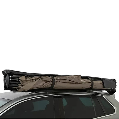 Folded Rhino-Rack Batwing Compact Awning strapped to crossbars for storage