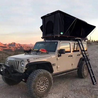 2025 Camp-In AO Aluminum Pop-Up Rooftop Tent mounted on Jeep Wrangler at sunset