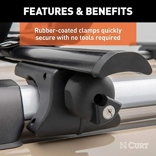 Close-up of CURT universal raised rail roof rack crossbar clamp with rubber coating and locking knob installed on vehicle roof rail