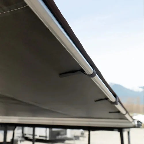 Dog House car side awning aluminum frame close-up under desert tan canvas