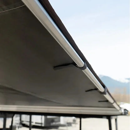 Dog House car side awning aluminum frame close-up under desert tan canvas